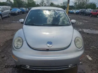 2001 Volkswagen Beetle GLX with VIN 3VWDD21C21M406898, listed as a Copart auction lot 55597675 with 104,597 mi miles and Salvage Title. Bid and sale history available at DreamBid. Image 5.