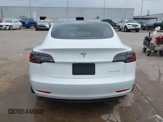 2021 Tesla Model 3 Long Range with VIN 5YJ3E1EB3MF059713, listed as a IAAI auction lot 41778289 with 52,211 mi miles. Bid and sale history available at carsss.com. Image 17.