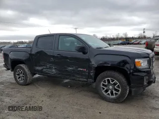 2022 GMC Canyon 4WD AT4 w/Leather with VIN 1GTG6FEN5N1279158, listed as a Copart auction lot 50958545 with 34,569 mi miles and Salvage Title. Bid and sale history available at carsss.com. Image 4.