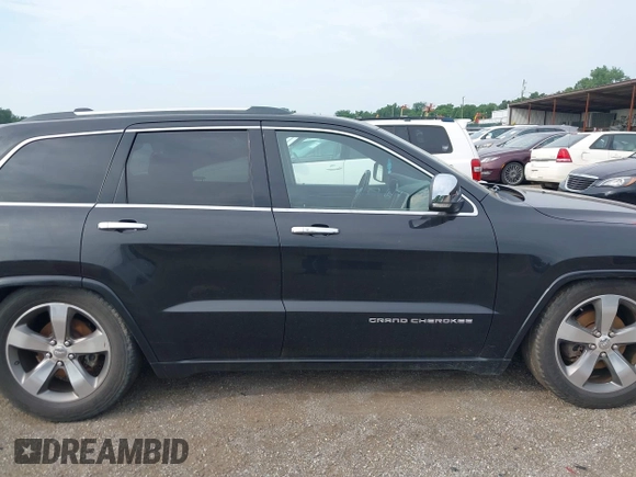 2015 Jeep Grand Cherokee High Altitude with VIN 1C4RJFCGXFC604663, listed as a IAAI auction lot 42816306 with 117,467 mi miles and . Bid and sale history available at DreamBid. Image 13.
