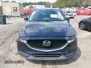 2021 Mazda CX-5 Grand Touring with VIN JM3KFBDM8M0484383, listed as a IAAI auction lot 41800786 with 58,617 mi miles. Bid and sale history available at carsss.com. Image 12.