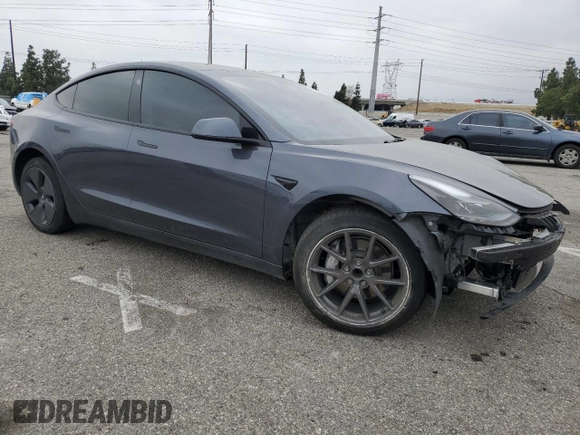 2023 Tesla Model 3 with VIN 5YJ3E1EA4PF642769, listed as a Copart auction lot 50648825 with 25,310 mi miles and Salvage title. Bid and sale history available at DreamBid. Image 4.