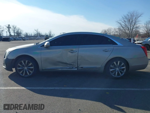 2013 Cadillac XTS Luxury z VIN 2G61R5S31D9185009, wystawiony jako IAAI lot #41243001 z przebiegiem 161 219 mil mil oraz . Historia ofert i sprzedaży dostępna na DreamBid. Obrazek 14.