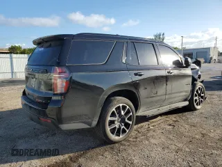 2023 Chevrolet Tahoe RST with VIN 1GNSCRKDXPR483465, listed as a Copart auction lot 77744604 with 11,078 mi miles and Salvage title. Bid and sale history available at DreamBid. Image 3.