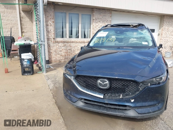 2018 Mazda CX-5 Grand Touring with VIN JM3KFADM1J1439544, listed as a IAAI auction lot 41891134 with 54,132 mi miles and . Bid and sale history available at DreamBid. Image 12.