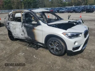 2019 BMW X1 xDrive28i with VIN WBXHT3C55K5L89892, listed as a Copart auction lot 55467665 with Not provided miles and Salvage title. Bid and sale history available at DreamBid. Image 4.