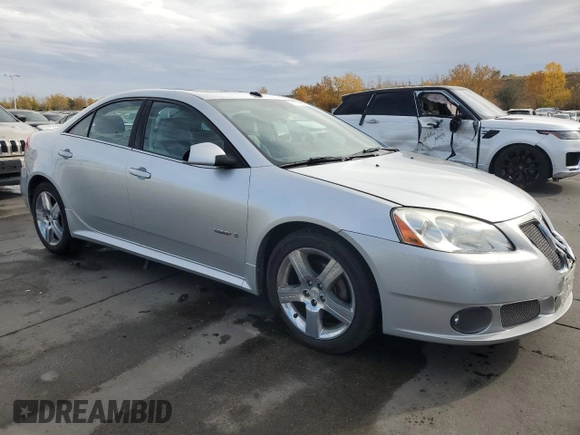 2009 Pontiac G6 with VIN 1G2ZL577094232011, listed as a Copart auction lot 77175054 with 133,353 mi miles and Salvage title. Bid and sale history available at DreamBid. Image 4.