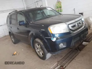 2009 Honda Pilot EX-L with VIN 5FNYF48509B036410, listed as a IAAI auction lot 41859708 with 216,558 mi miles. Bid and sale history available at carsss.com. Image 1.