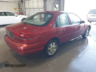 1999 Mercury Mystique GS z VIN 1MEFM6536XK637928, wystawiony jako IAAI lot #41850298 z przebiegiem 219 329 mil mil oraz . Historia ofert i sprzedaży dostępna na DreamBid. Obrazek 4.