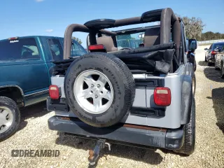 2004 Jeep Wrangler Sport with VIN 1J4FA49SX4P776775, listed as a Copart auction lot 74946824 with Not Provided miles and Salvage Title. Bid and sale history available at carsss.com. Image 6.