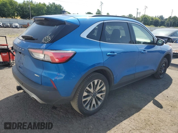 2020 Ford Escape Titanium z VIN 1FMCU9J90LUB15564, wystawiony jako Copart lot #59673625 z przebiegiem 84 474 mil mil oraz Czysty tytuł • Clean title. Historia ofert i sprzedaży dostępna na DreamBid. Obrazek 3.