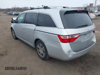 2013 Honda Odyssey EX-L with VIN 5FNRL5H65DB050789, listed as a IAAI auction lot 41911537 with 160,348 mi miles and . Bid and sale history available at carsss.com. Image 3.