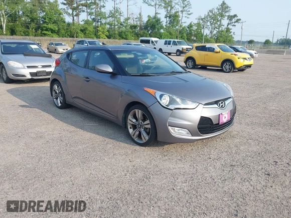 2012 Hyundai Veloster w/Gray Int z VIN KMHTC6AD1CU081754, wystawiony jako IAAI lot #42421889 z przebiegiem 99 593 mil mil oraz . Historia ofert i sprzedaży dostępna na DreamBid. Obrazek 1.