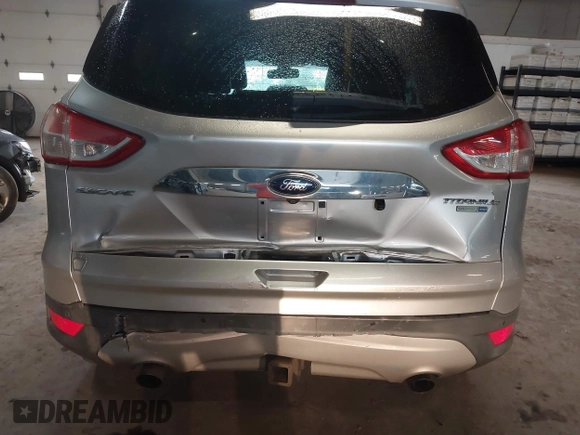 2015 Ford Escape Titanium z VIN 1FMCU9J96FUB23902, wystawiony jako IAAI lot #42497188 z przebiegiem 164 452 mil mil oraz . Historia ofert i sprzedaży dostępna na DreamBid. Obrazek 6.