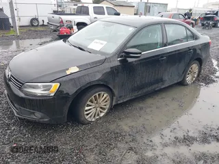 2014 Volkswagen Jetta TDI w/Premium with VIN 3VWLL7AJ1EM406360, listed as a IAAI auction lot 41857580 with 93,333 mi miles and . Bid and sale history available at DreamBid. Image 2.