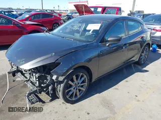 2018 Mazda 3 Touring with VIN 3MZBN1L34JM164952, listed as a IAAI auction lot 42179420 with 106,706 mi miles and . Bid and sale history available at DreamBid. Image 17.