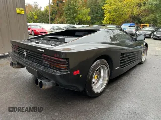 1988 Pontiac Fiero z VIN 1G2PE119XJP213392, wystawiony jako Copart lot #76264064 z przebiegiem 71 246 mil mil oraz Tytuł czysty. Historia ofert i sprzedaży dostępna na DreamBid. Obrazek 4.