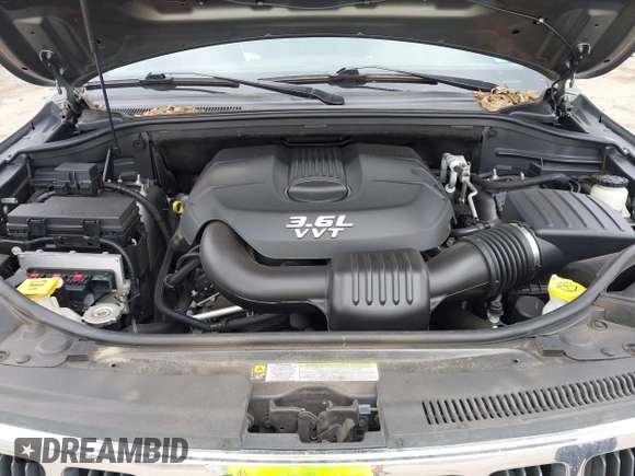 2013 Jeep Grand Cherokee Laredo with VIN 1C4RJEAG2DC571569, listed as a IAAI auction lot 41100518 with 98,265 mi miles. Bid and sale history available at carsss.com. Image 10.