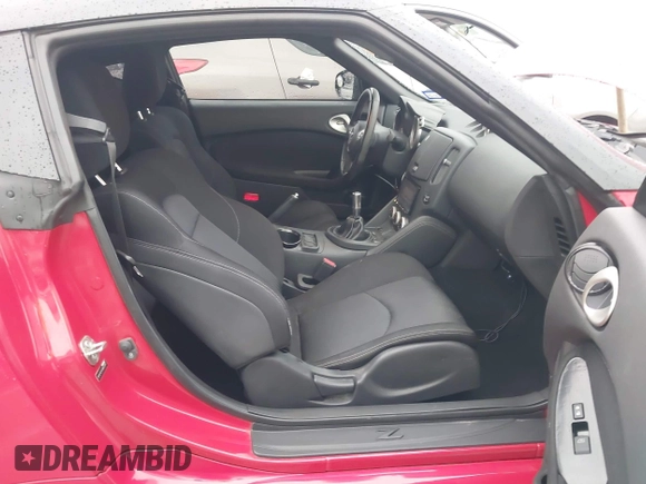 2016 Nissan 370Z z VIN JN1AZ4EHXGM932681, wystawiony jako IAAI lot #42350850 z przebiegiem 94 586 mil mil oraz . Historia ofert i sprzedaży dostępna na DreamBid. Obrazek 5.