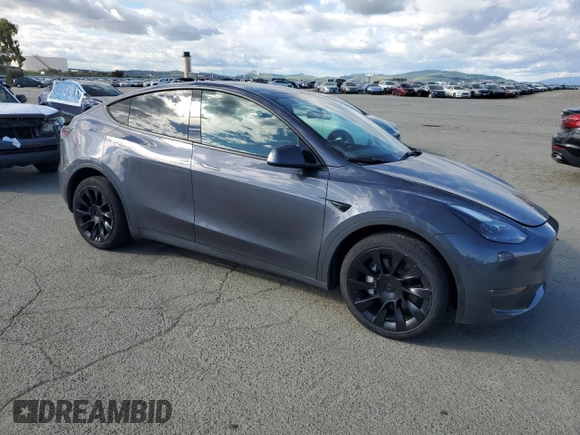 2023 Tesla Model Y Long Range with VIN 7SAYGDEE9PF638742, listed as a Copart auction lot 48188455 with 30,550 mi miles and Salvage Title. Bid and sale history available at DreamBid. Image 4.