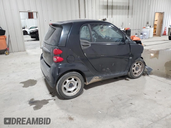 2011 Smart fortwo Pure с VIN WMEEJ3BA5BK480412, выставлен на аукционе Copart как лот 87023194 с пробегом 70 496 миль миль и Списание • Salvage title. История ставок и продаж доступна на DreamBid. Изображение 3.