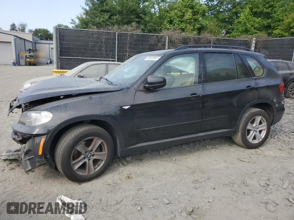2012 BMW X5 35i with VIN 5UXZV4C5XCL761370, listed as a Copart auction lot 59436845 with 124,722 mi miles and Salvage title. Bid and sale history available at DreamBid. Image 1.