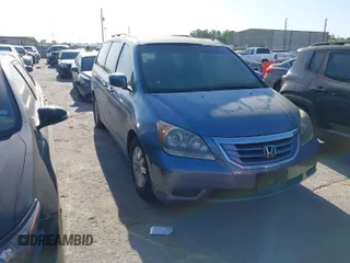 2009 Honda Odyssey EX-L with VIN 5FNRL38759B001130, listed as a IAAI auction lot 42004710 with 142,126 mi miles. Bid and sale history available at carsss.com. Image 1.