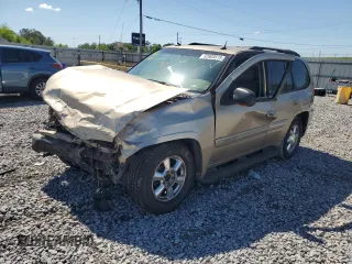 2004 GMC Envoy SLT with VIN 1GKDS13S942270065, listed as a Copart auction lot 52803515 with 242,026 mi miles and Salvage Title. Bid and sale history available at carsss.com. Image 1.