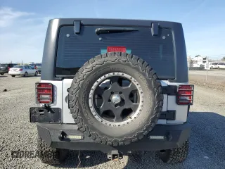 2012 Jeep Wrangler Sport z VIN 1C4AJWAG3CL151885, wystawiony jako Copart lot #51682175 z przebiegiem 111 544 mil mil oraz Szkoda całkowita • Salvage title. Historia ofert i sprzedaży dostępna na DreamBid. Obrazek 6.