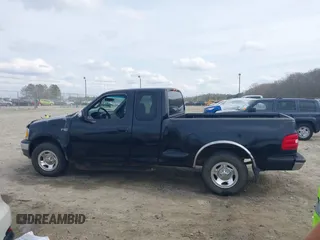 2000 Ford F-150 XL with VIN 1FTZX0725YKA09559, listed as a IAAI auction lot 41810954 with Not provided miles and . Bid and sale history available at DreamBid. Image 14.