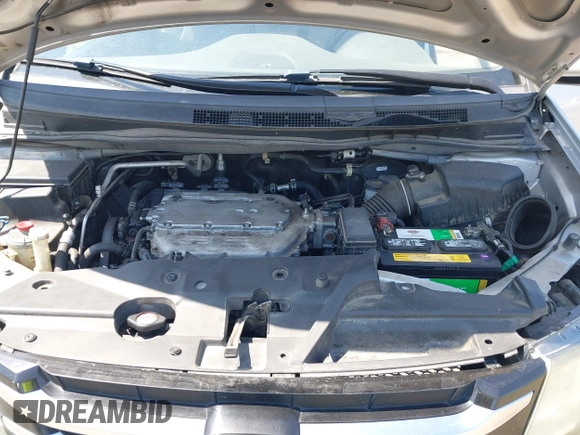 2014 Honda Odyssey Touring with VIN 5FNRL5H91EB068427, listed as a IAAI auction lot 42163315 with 184,134 mi miles and . Bid and sale history available at DreamBid. Image 10.
