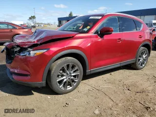 2021 Mazda CX-5 Signature with VIN JM3KFBEYXM0434778, listed as a Copart auction lot 51980255 with 34,283 mi miles and Salvage Title. Bid and sale history available at carsss.com. Image 1.