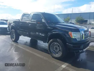 2011 Ford F-150 XLT with VIN 1FTFW1ET1BFA99509, listed as a IAAI auction lot 41789526 with 169,442 mi miles. Bid and sale history available at carsss.com. Image 1.
