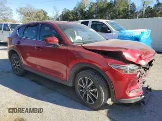 2018 Mazda CX-5 Grand Touring with VIN JM3KFADM1J1454982, listed as a Copart auction lot 49162495 with 109,559 mi miles and Salvage Title. Bid and sale history available at DreamBid. Image 4.
