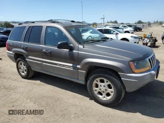 2000 Jeep Grand Cherokee Laredo with VIN 1J4G248S6YC333068, listed as a Copart auction lot 54972765 with 183,775 mi miles and Clean title. Bid and sale history available at DreamBid. Image 4.