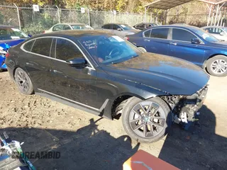2023 BMW i4 eDrive40 z VIN WBY73AW01PFN46010, wystawiony jako IAAI lot #40823110 z przebiegiem 14 591 mil mil oraz . Historia ofert i sprzedaży dostępna na DreamBid. Obrazek 1.