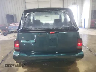 1996 Chevrolet Tracker z VIN 2CNBJ1869T6903842, wystawiony jako Copart lot #87734315 z przebiegiem 120 835 mil mil oraz Szkoda całkowita • Salvage title. Historia ofert i sprzedaży dostępna na DreamBid. Obrazek 6.