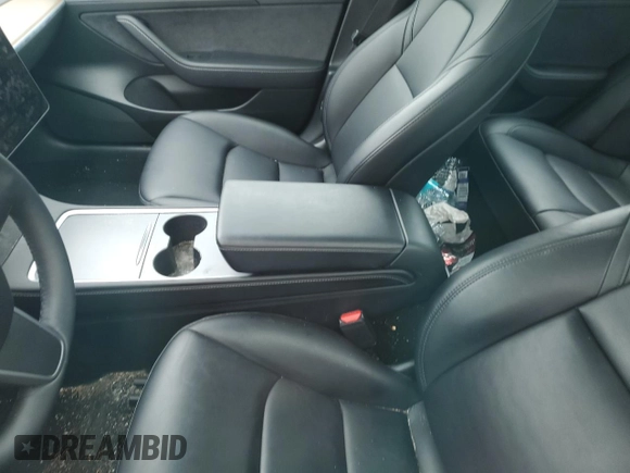 2023 Tesla Model 3 with VIN 5YJ3E1EA7PF599058, listed as a Copart auction lot 57331365 with Not provided miles and Non repairable. Bid and sale history available at DreamBid. Image 8.