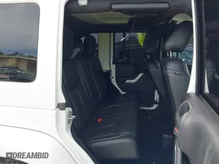 2015 Jeep Wrangler Unlimited Rubicon Hard Rock with VIN 1C4HJWFG7FL684057, listed as a IAAI auction lot 41963885 with 103,240 mi miles. Bid and sale history available at carsss.com. Image 8.