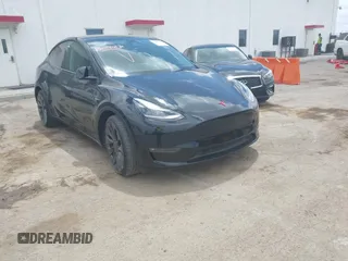 2023 Tesla Model Y Performance with VIN 7SAYGDEF4PF809308, listed as a IAAI auction lot 42056769 with 12,101 mi miles and . Bid and sale history available at DreamBid. Image 1.