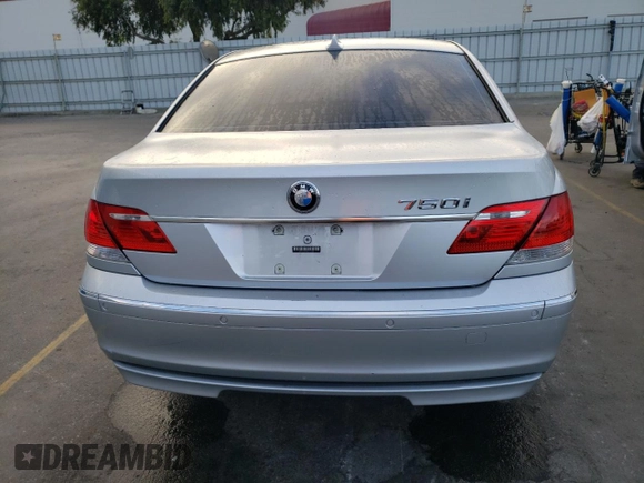 2006 BMW 7 Series 750i with VIN WBAHL83586DT05258, listed as a Copart auction lot 77033744 with 129,376 mi miles and Salvage Title. Bid and sale history available at DreamBid. Image 6.