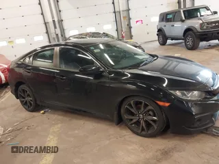 2019 Honda Civic Sport with VIN 19XFC2F89KE206213, listed as a IAAI auction lot 41804863 with 76,052 mi miles and . Bid and sale history available at DreamBid. Image 14.