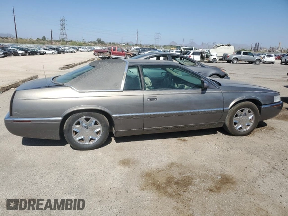1998 Cadillac Eldorado z VIN 1G6EL12YXWU610918, wystawiony jako Copart lot #57309075 z przebiegiem 168 228 mil mil oraz Szkoda całkowita • Salvage title. Historia ofert i sprzedaży dostępna na DreamBid. Obrazek 3.