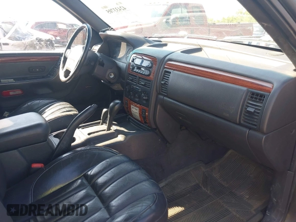 1999 Jeep Grand Cherokee Limited with VIN 1J4GW68N7XC617687, listed as a IAAI auction lot 42433705 with 186,312 mi miles and . Bid and sale history available at DreamBid. Image 5.