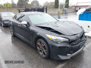 2018 Kia Stinger GT1 with VIN KNAE45LC4J6035780, listed as a IAAI auction lot 41560394 with 86,312 mi miles. Bid and sale history available at carsss.com. Image 1.