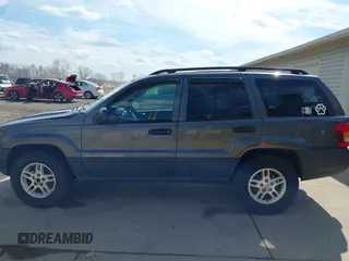 2003 Jeep Grand Cherokee Laredo with VIN 1J4GX48S53C504225, listed as a IAAI auction lot 41879669 with 247,246 mi miles. Bid and sale history available at carsss.com. Image 15.