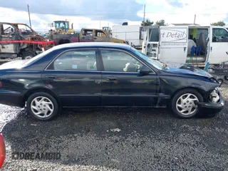 2000 Mazda 626 LX with VIN 1YVGF22CXY5123930, listed as a IAAI auction lot 40712369 with 210,234 mi miles. Bid and sale history available at carsss.com. Image 13.