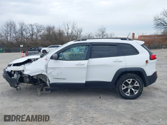 2015 Jeep Cherokee Trailhawk with VIN 1C4PJMBB7FW741365, listed as a IAAI auction lot 41879685 with 94,135 mi miles and . Bid and sale history available at carsss.com. Image 15.