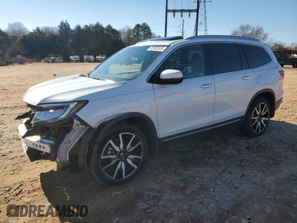 2022 Honda Pilot Touring 7-Passenger with VIN 5FNYF6H66NB059642, listed as a Copart auction lot 87802435 with 26,039 mi miles and Salvage Title. Bid and sale history available at carsss.com. Image 1.