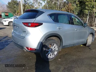 2020 Mazda CX-5 Grand Touring z VIN JM3KFADM0L0738337, wystawiony jako IAAI lot #41485078 z przebiegiem Nie podano mil oraz . Historia ofert i sprzedaży dostępna na DreamBid. Obrazek 15.